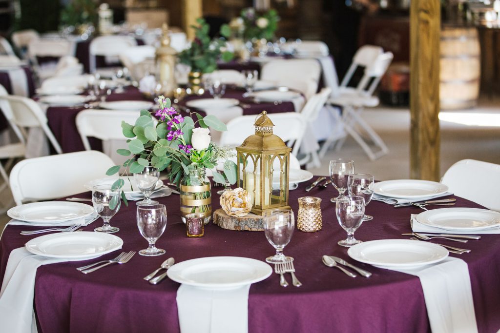 wedding reception in plum colored table cloths